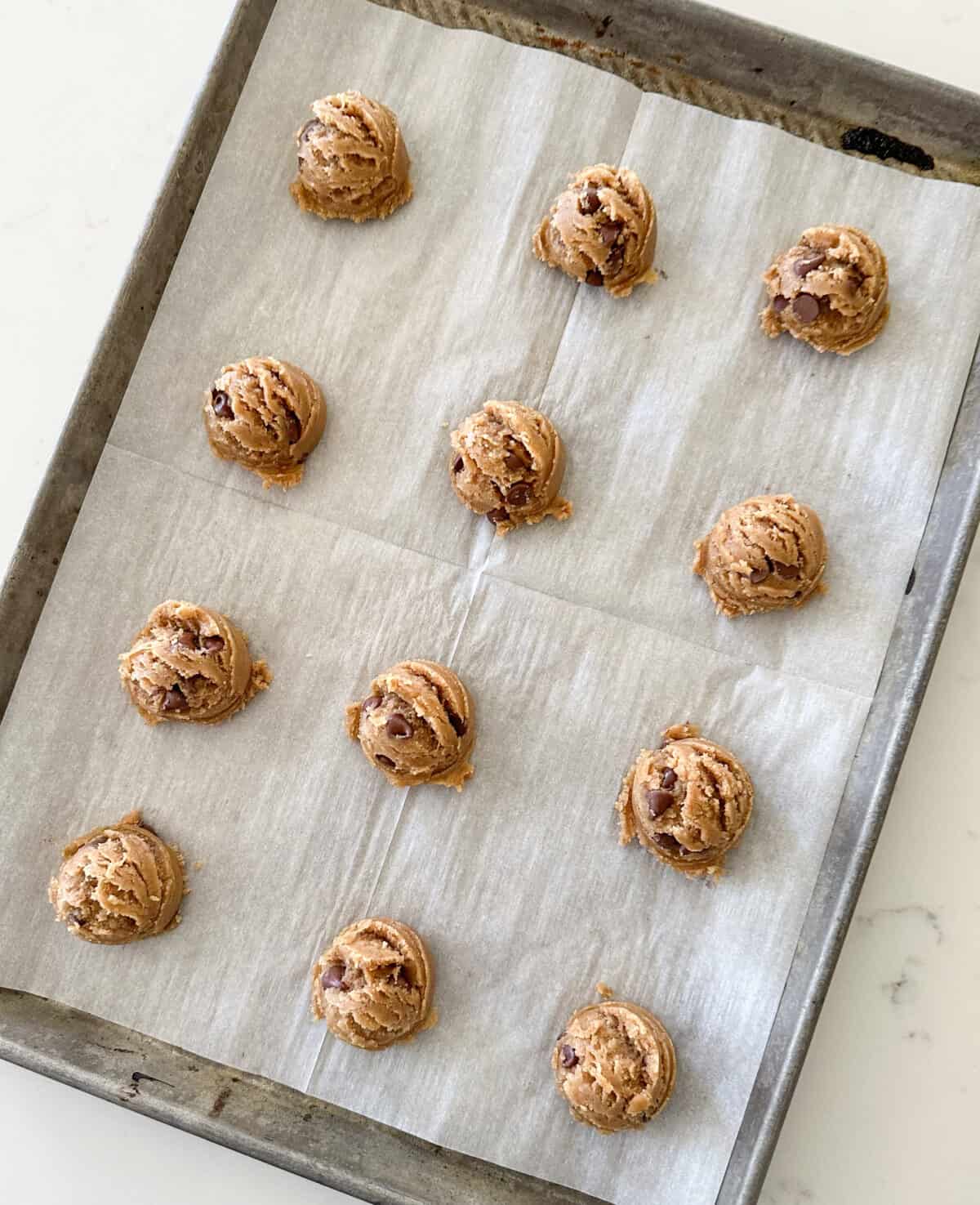 pumpkin spice cookie dough on baking sheet