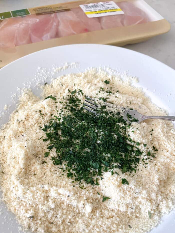 parsley added to plate of parmesan and ranch seasoning