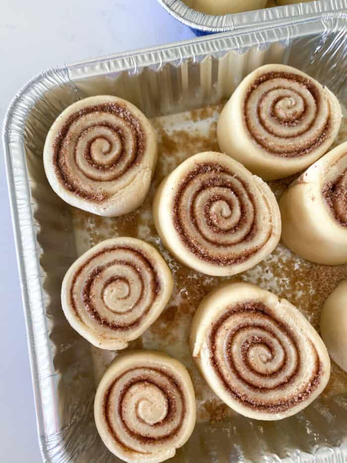 cinnamon rolls placed into baking pan