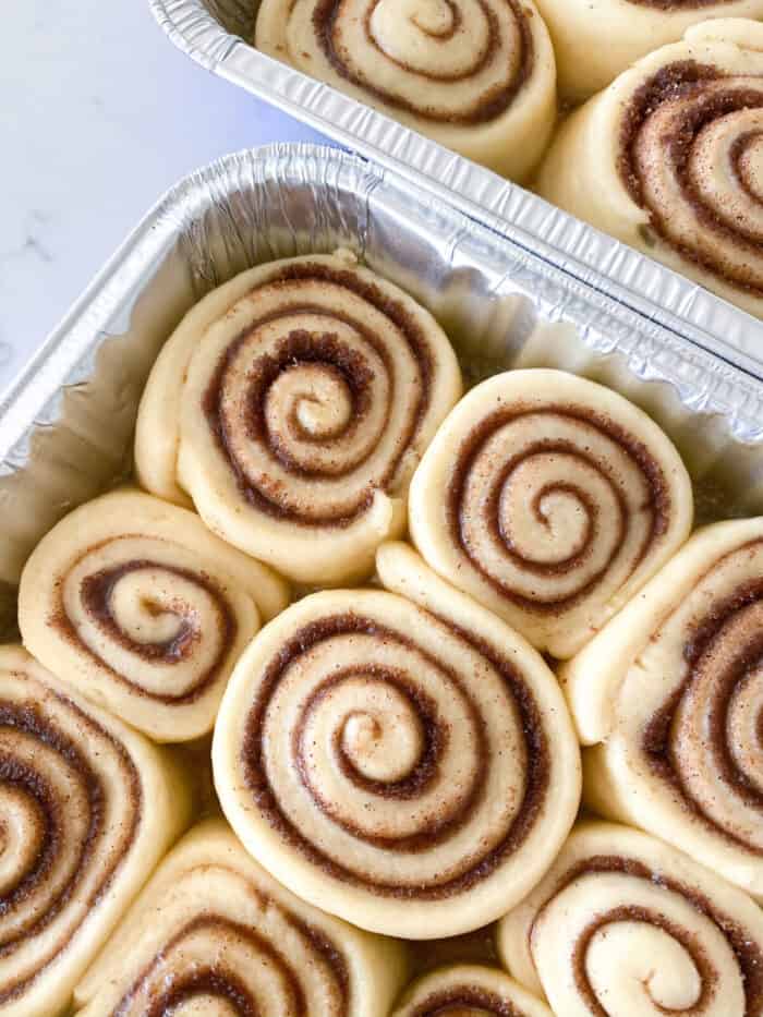 cinnamon rolls that have rised in baking pan