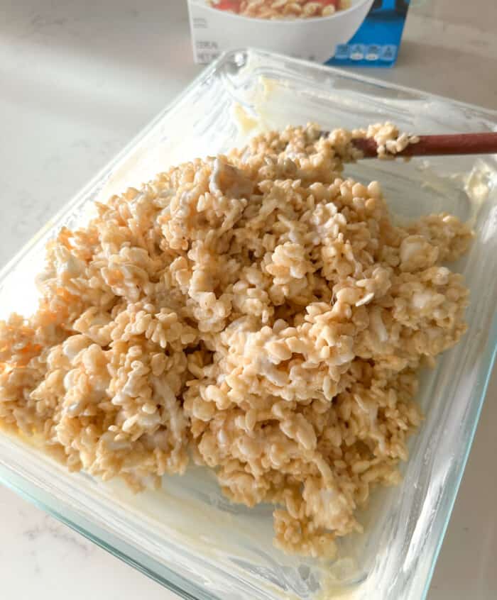 warm rice krispie treats poured into pan