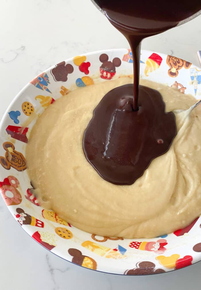 pouring chocolate into cake batter