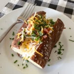 loaded baked potato on serving plate