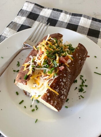 loaded baked potato on serving plate