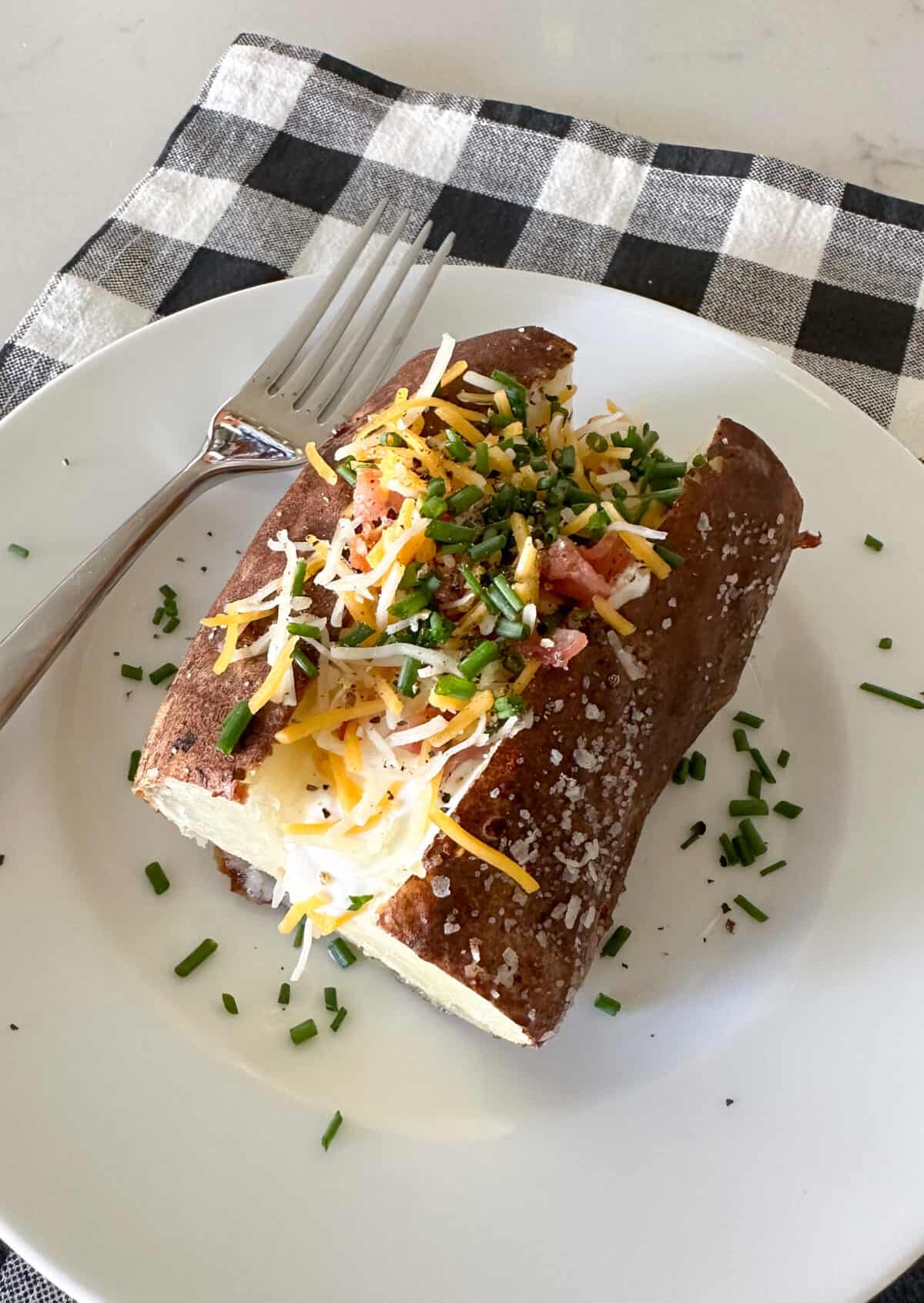 loaded baked potato on serving plate