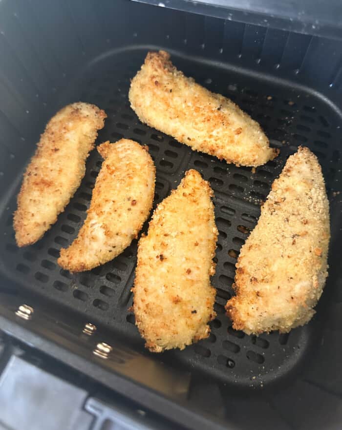 chicken tenders cooked inside air fryer basket