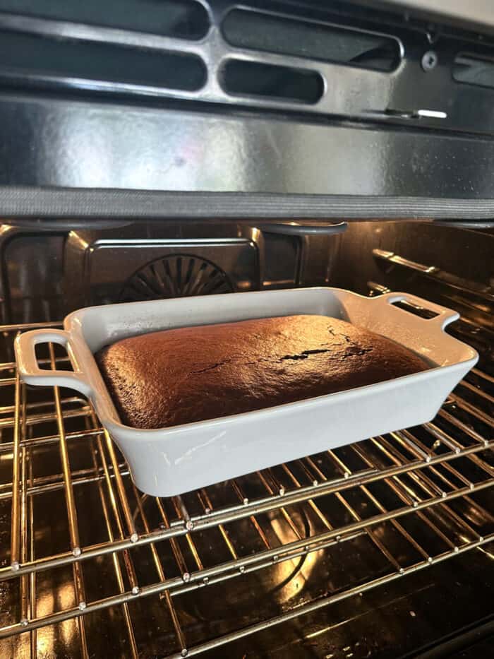 devils food cake baked in pan in the oven