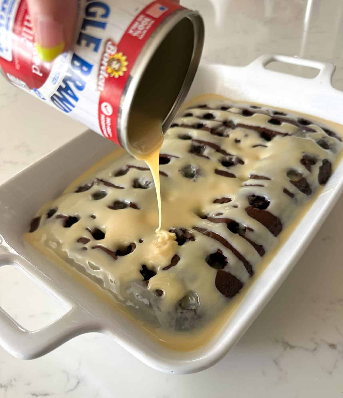 pouring sweetened condensed milk over better than sex cake