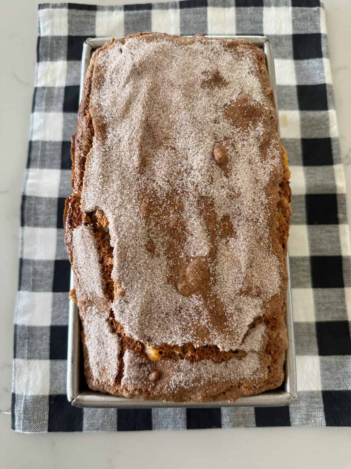 oatmeal banana bread baked in loaf pan on counter