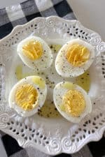 air fryer hard boiled eggs cut in half on serving plate