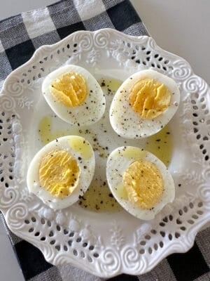 air fryer hard boiled eggs cut in half on serving plate