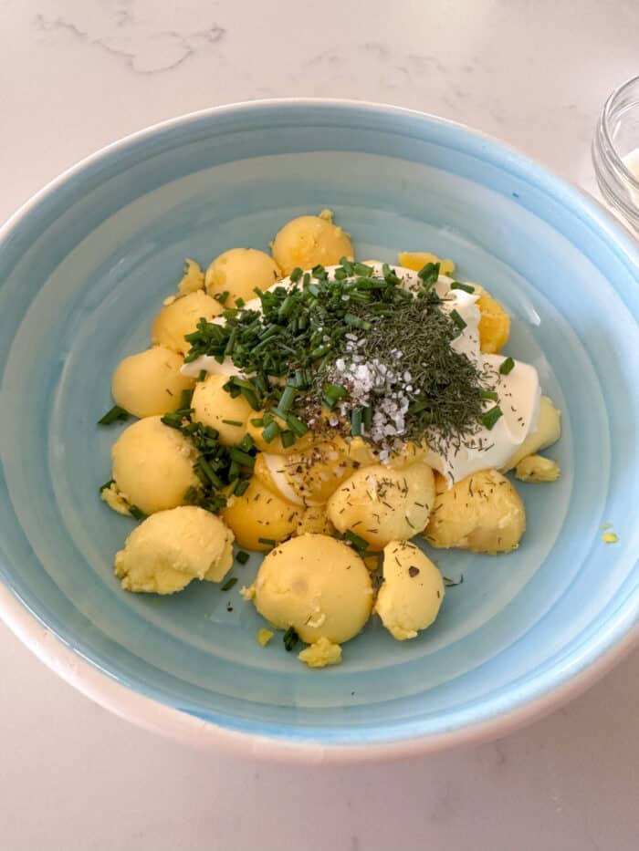 hard boiled egg yolks in mixing bowl with seasonings