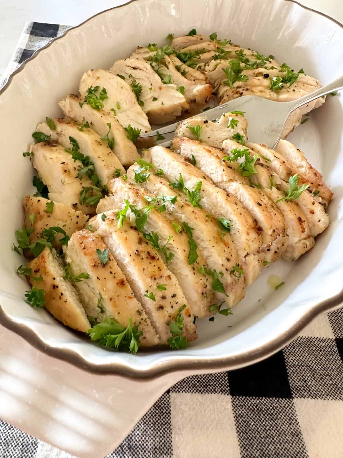 chicken breast sliced in serving dish
