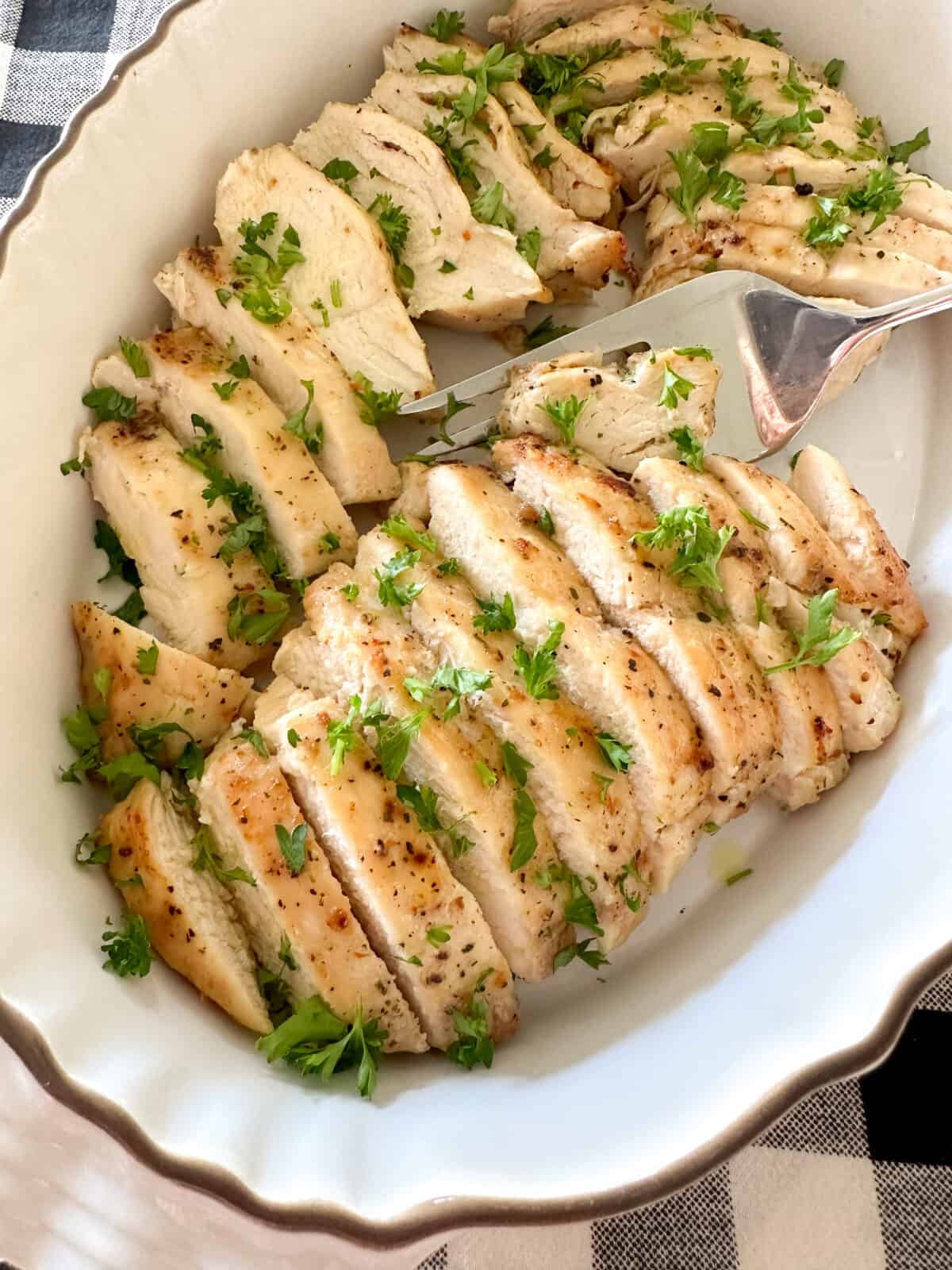 air fryer chicken breast sliced in serving dish