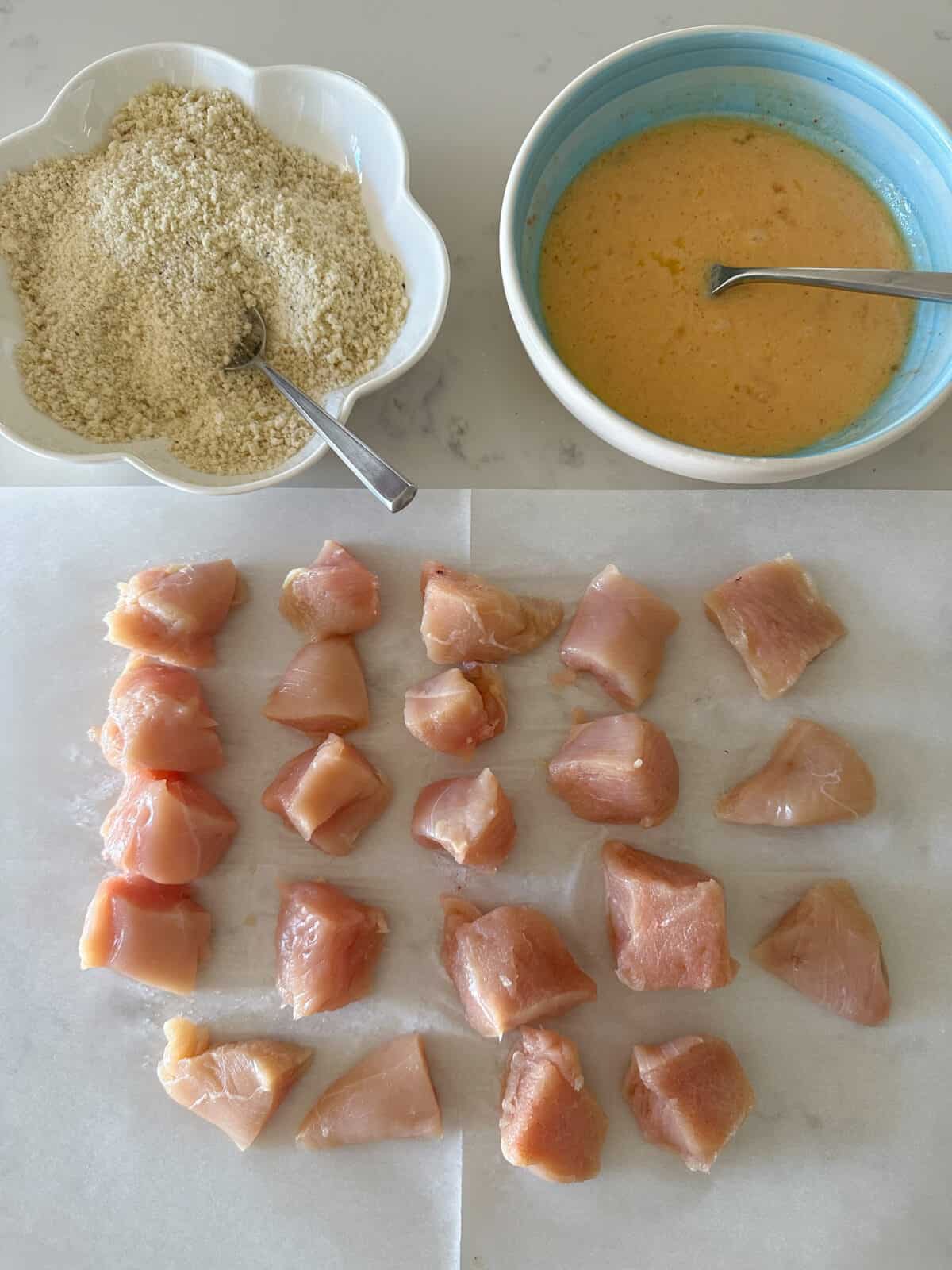 chicken breast cut into cubes ready for egg dip and panko coating