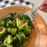 close up of air fryer broccoli in a serving bowl