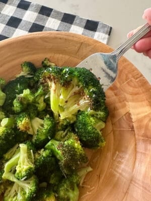 close up of air fryer broccoli in a serving bowl