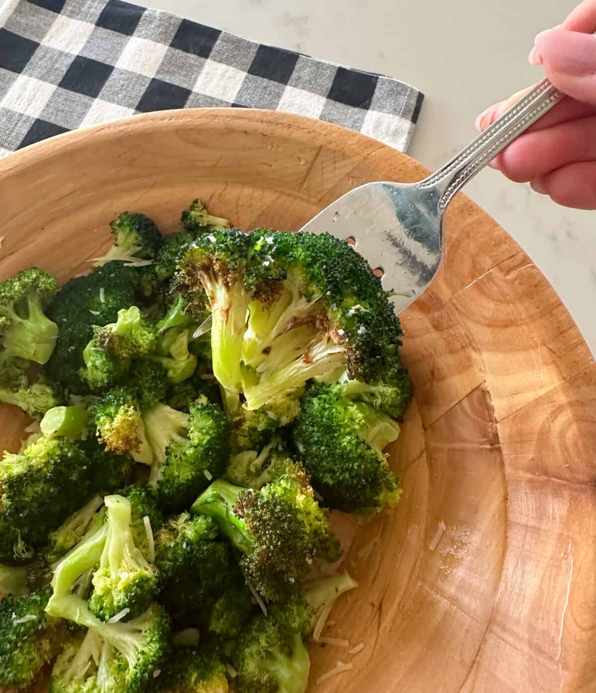 close up of air fryer broccoli in a serving bowl