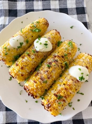 corn on the cob on serving plate with butter