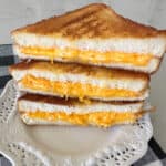 grilled cheese sandwiches cut in half stacked