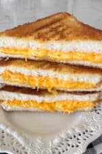 grilled cheese sandwiches cut in half stacked