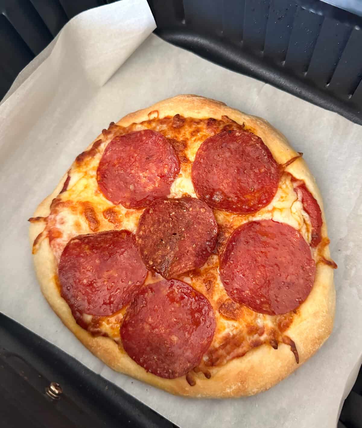 pizza cooked in air fryer basket
