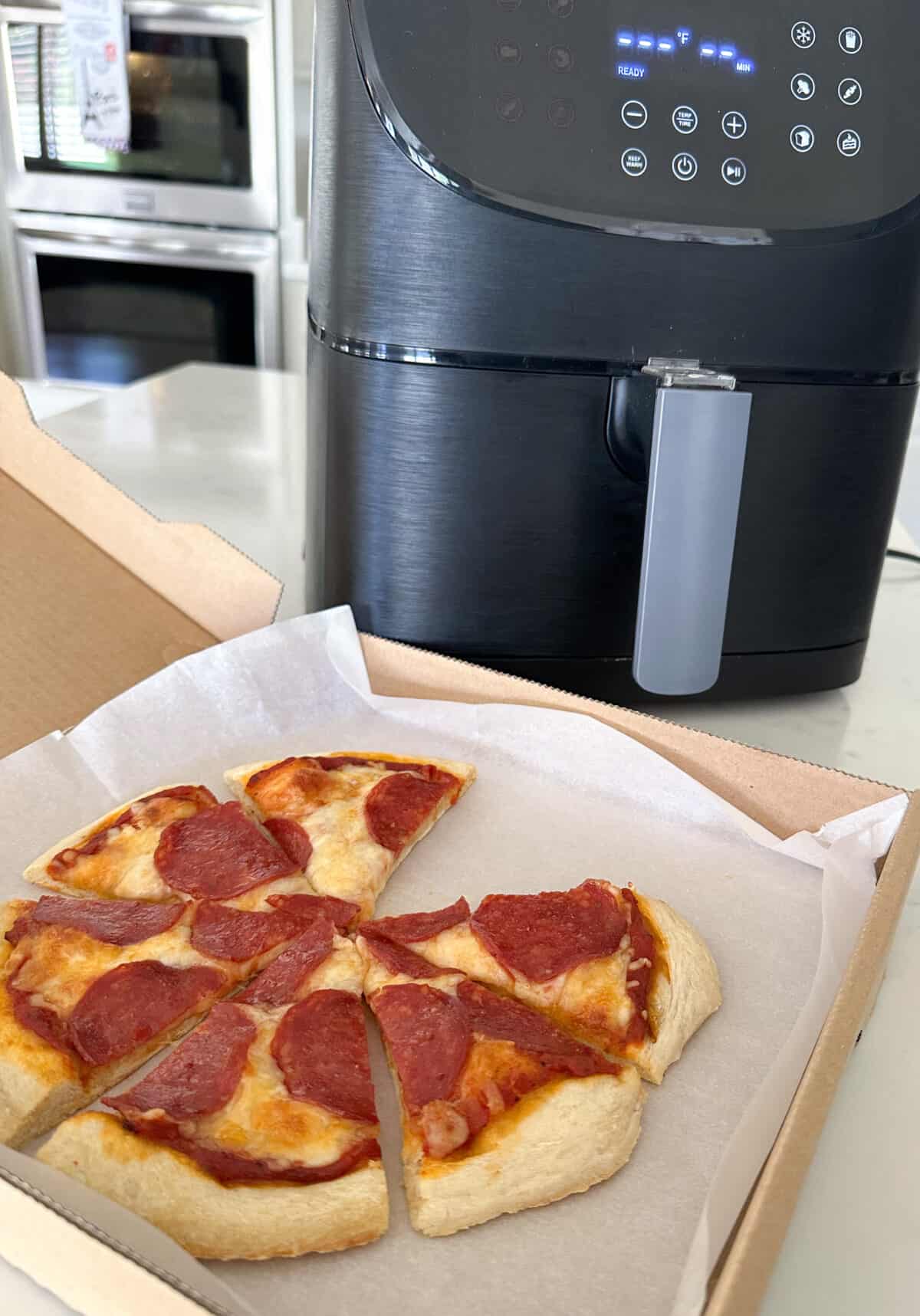 leftover pizza ready to reheat in air fryer