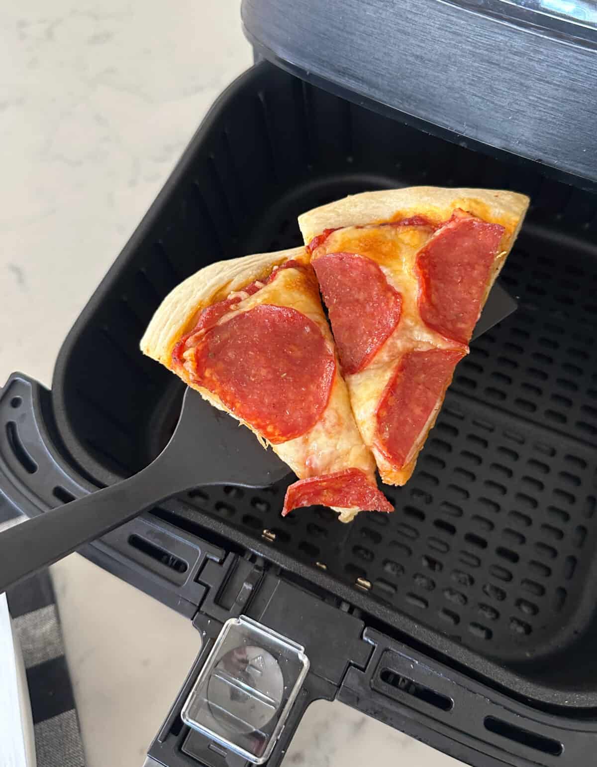 removing pizza from air fryer