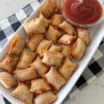 pizza rolls on serving plate with dipping sauce