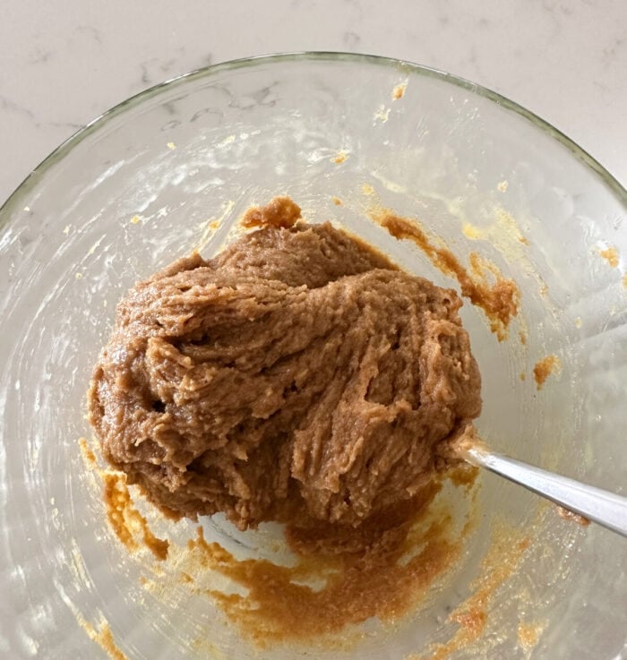mixing wet ingredients for peanut butter cookies
