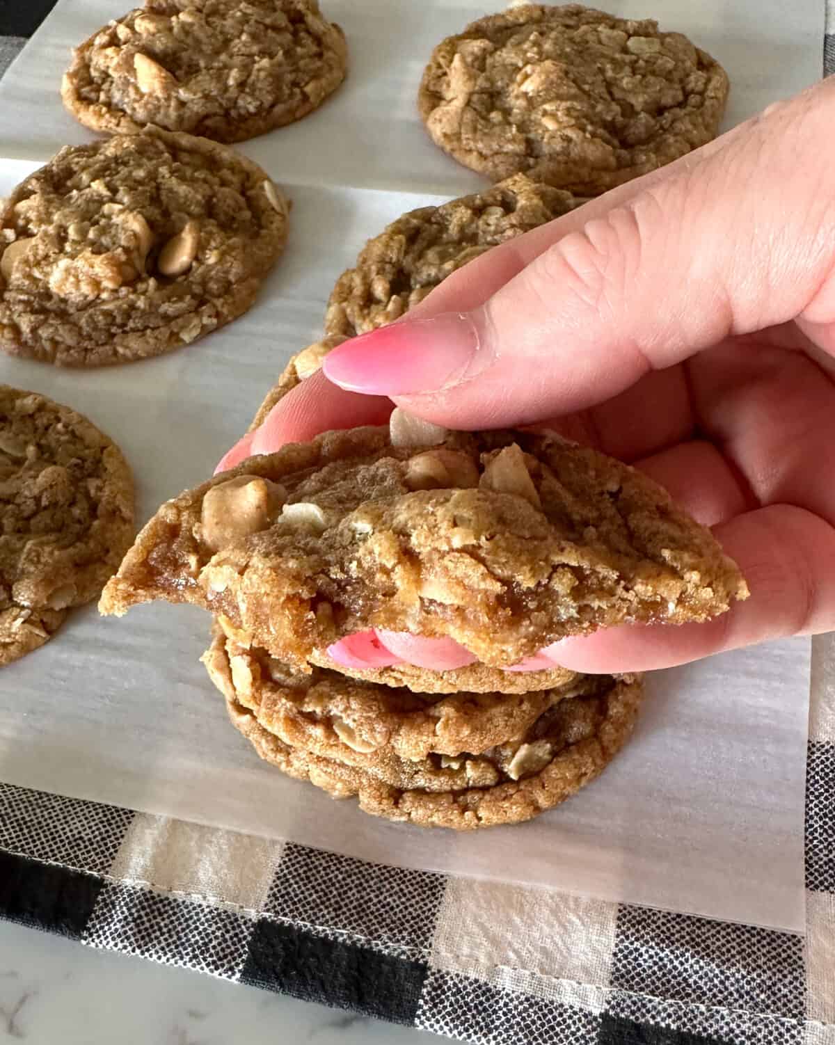 holding flourless peanut butter cookie to show inside