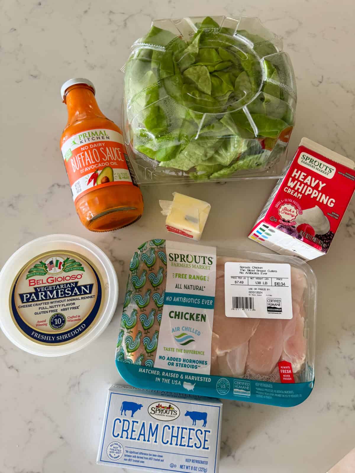 ingredients for alfredo buffalo chicken wrap on counter