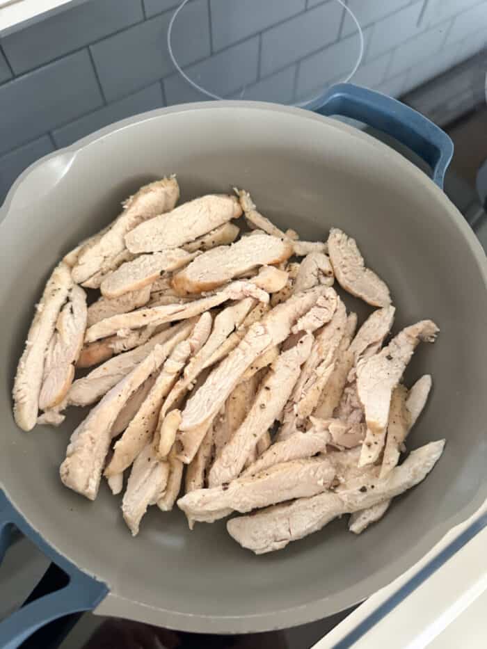 sliced chicken in skillet