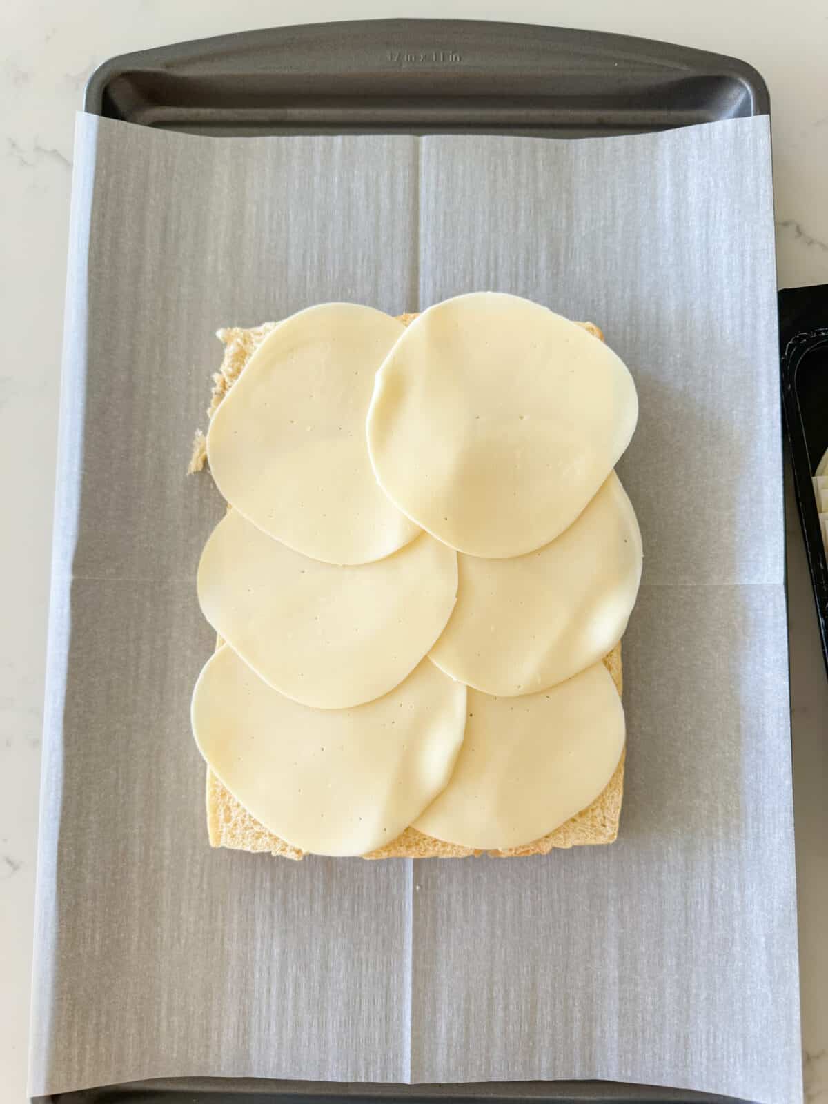 provolone slices added to hawaiian rolls