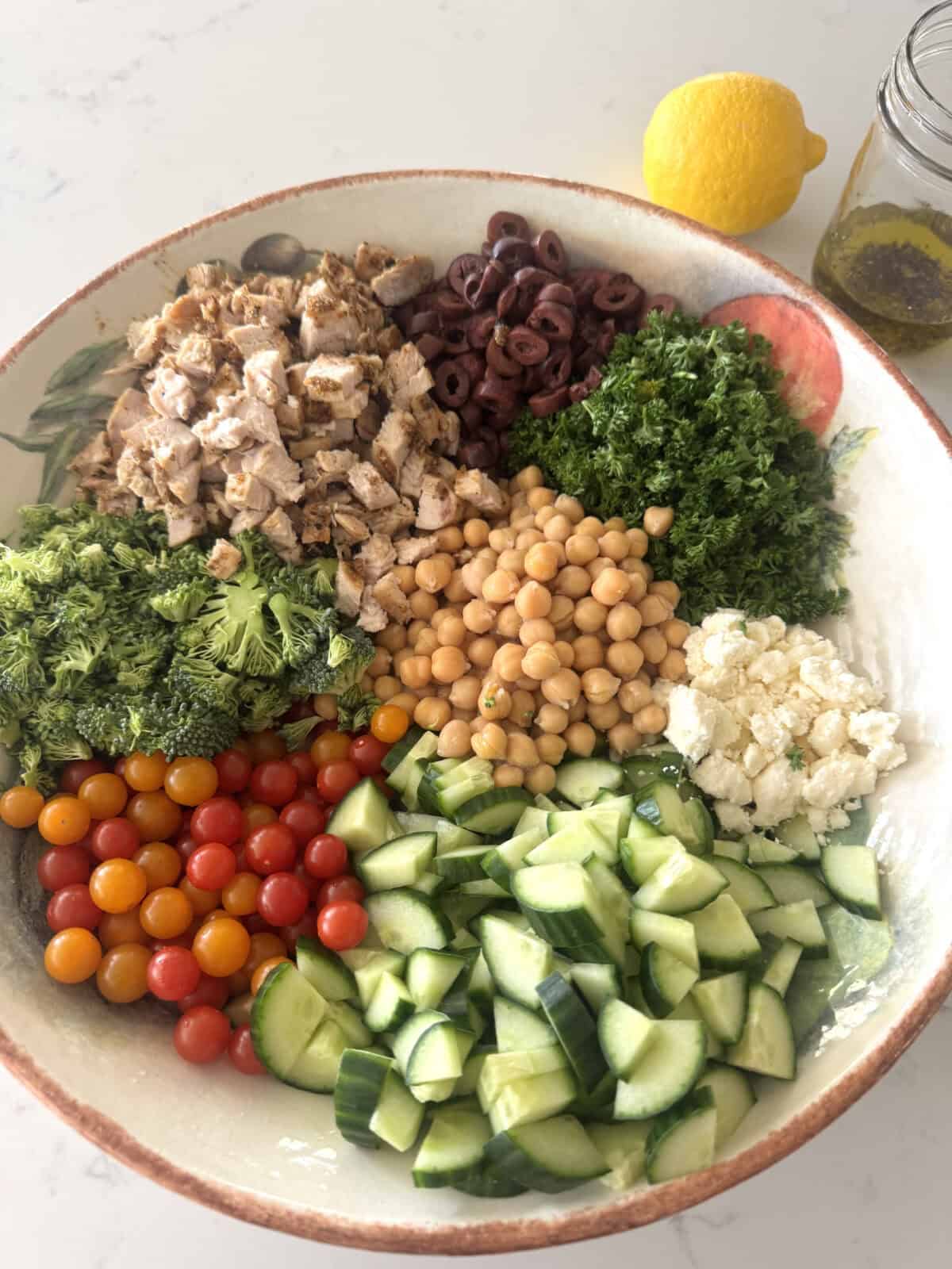 ingredients for mediterranean salad in large salad bowl
